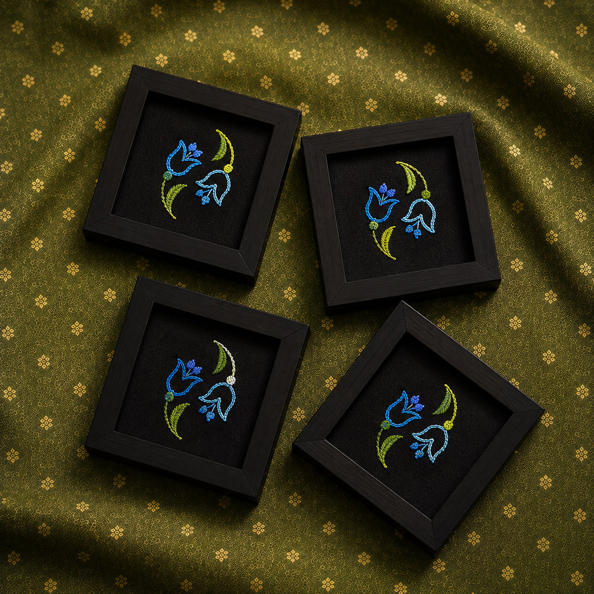 set of four hand embroidered raw silk coasters in wooden frames, black