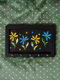hand embroidered raw silk key holder in a wooden frame, black