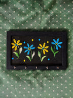 hand embroidered raw silk key holder in a wooden frame, black