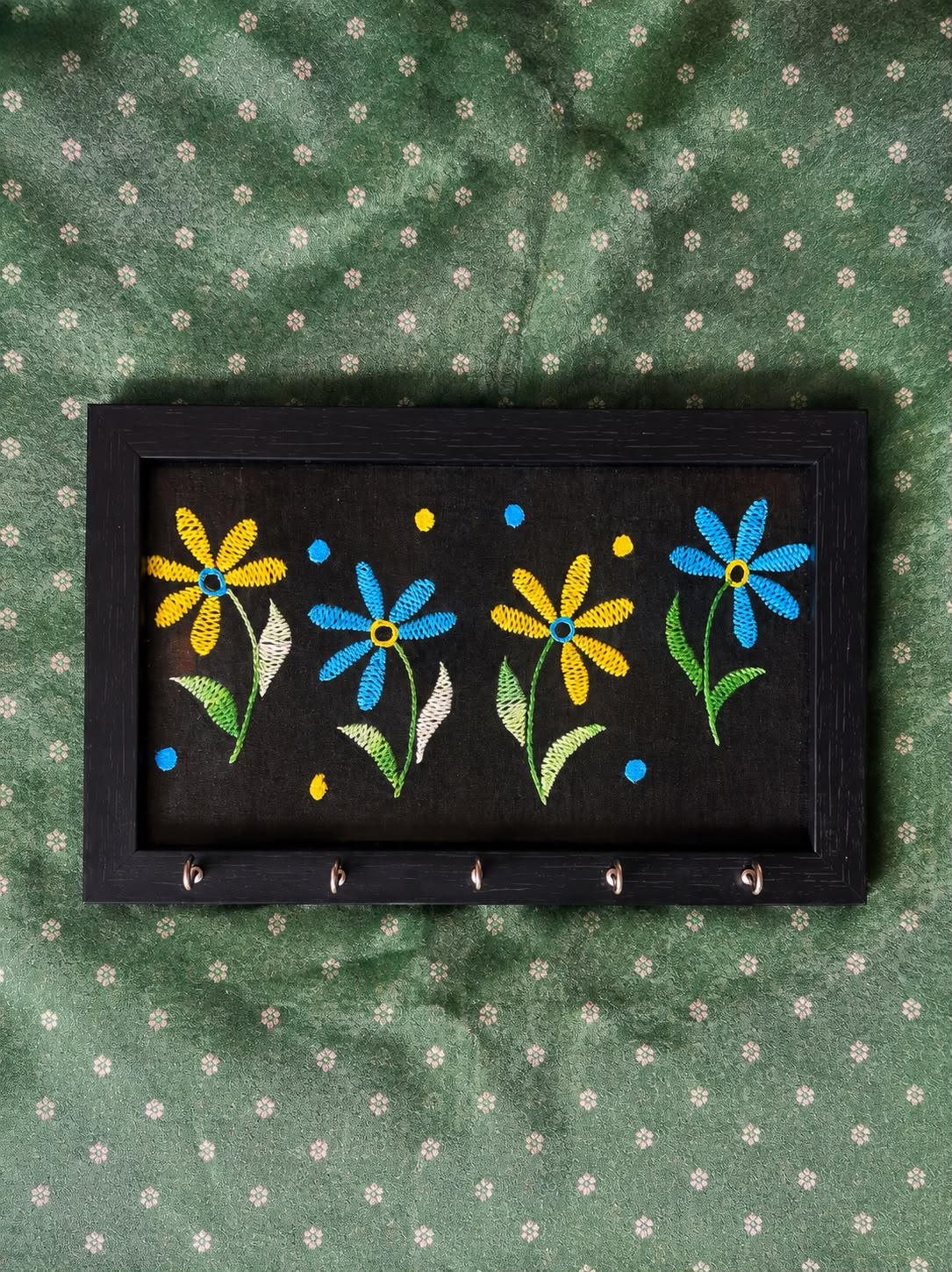 hand embroidered raw silk key holder in a wooden frame, black