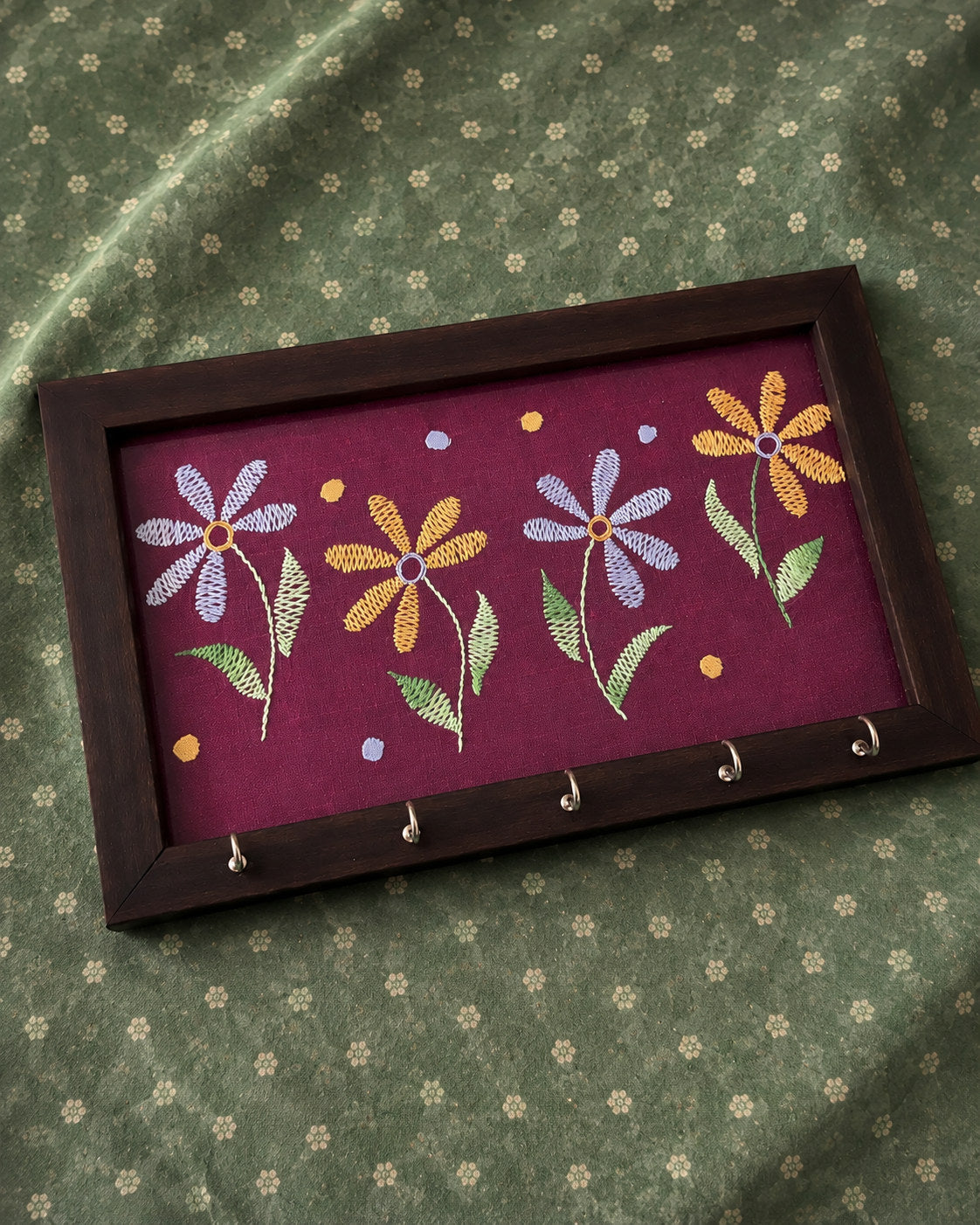 hand embroidered raw silk key holder in a wooden frame, pink