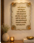 Handcrafted Navkar Mantra resin wall art with gold-leaf border, hung above a console table